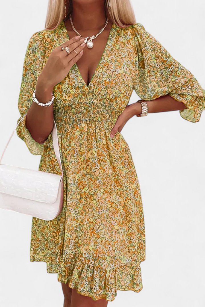 Robe Florale Benicia à Manches Bouffantes avec Ourlet Joueur